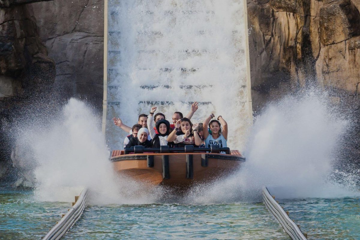Families enjoying a water ride at a UK theme park — fun kid-friendly attractions for summer trips.